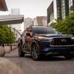 Grand Blue 2024 INFINITI QX60 passenger side and grille view