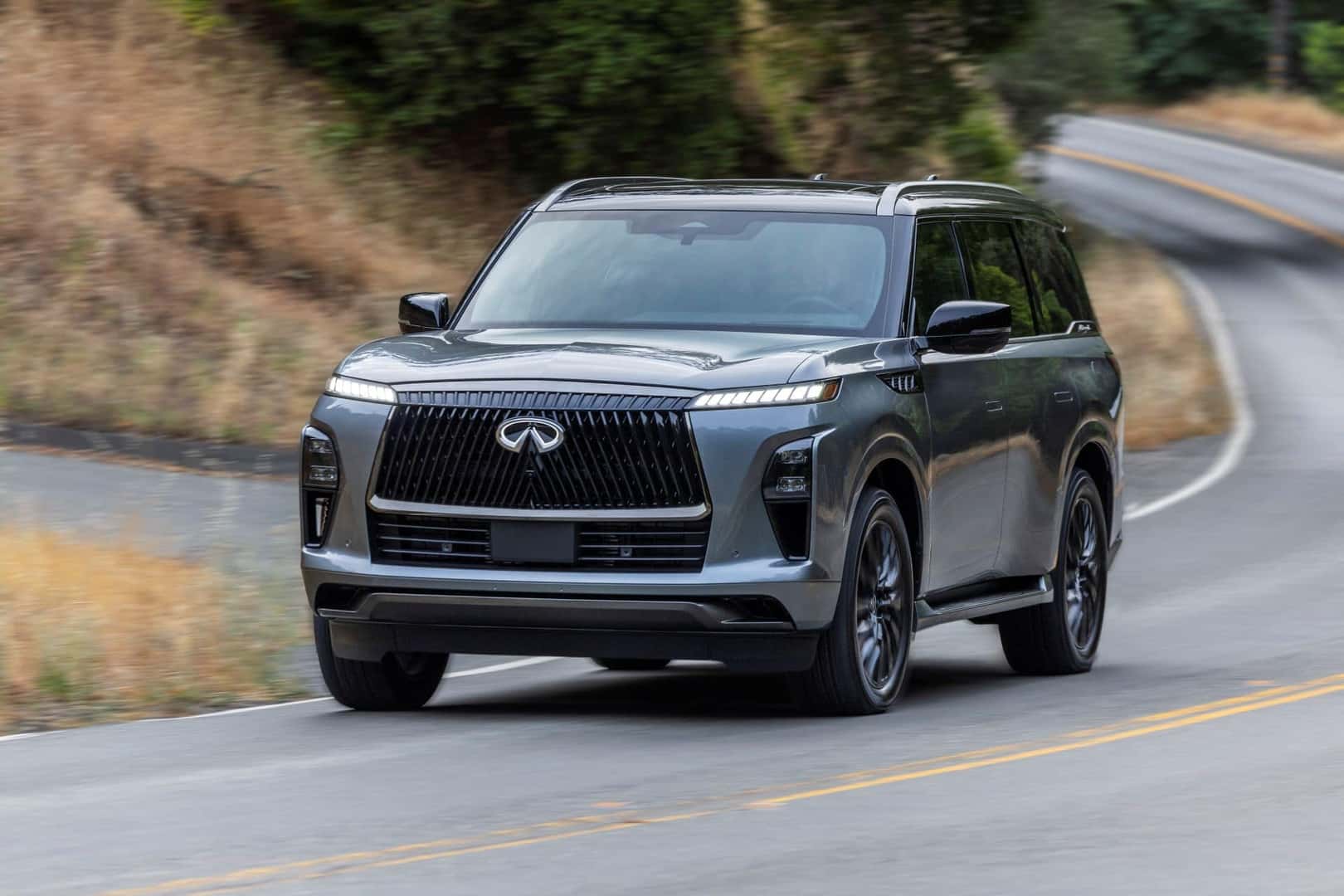 Anthracite Gray 2025 INFINITI QX80 driving