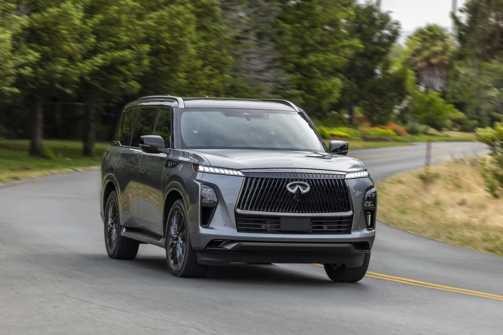 2025 INFINITI QX80 Anthracite Gray driving