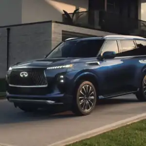 2026 INFINITI QX80 Grand Blue in driveway