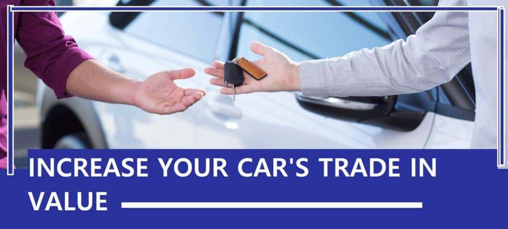 Two men exchanging a car key
