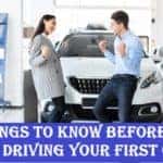 Man and woman excited about their first car