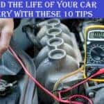 A hand touching battery terminals