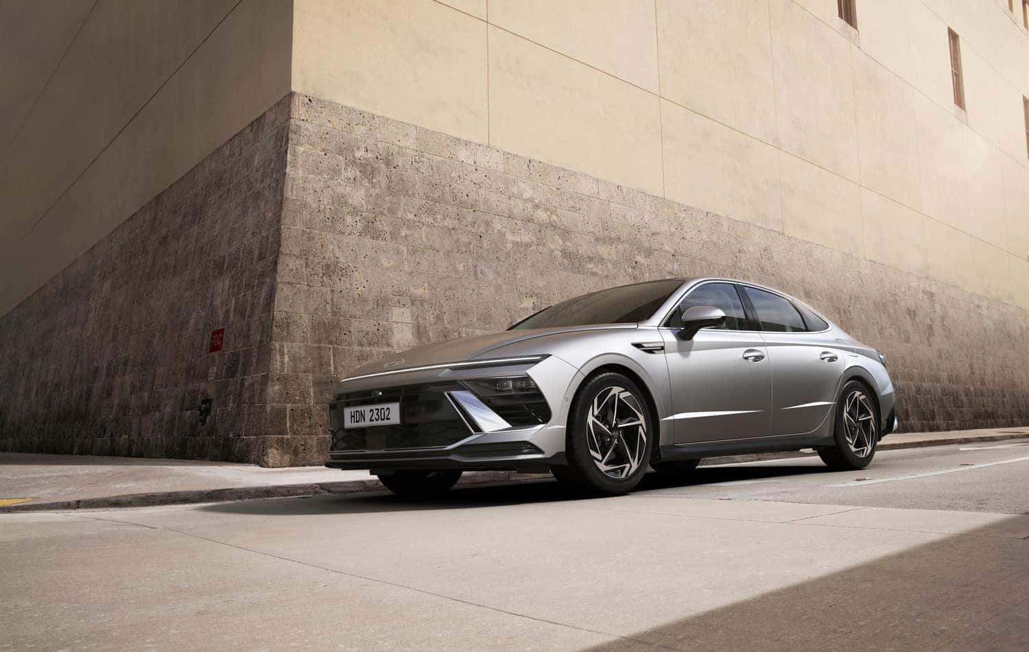 2024 Hyundai Sonata parked in front of a modern building