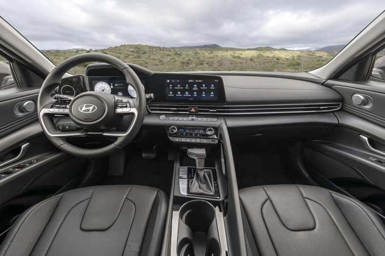 The interior of a 2025 Hyundai Elantra featuring modern design, comfortable seating, and advanced technology features.
