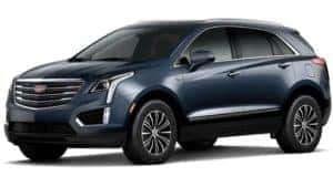 A blue 2019 Cadillac XT5 on white facing left
