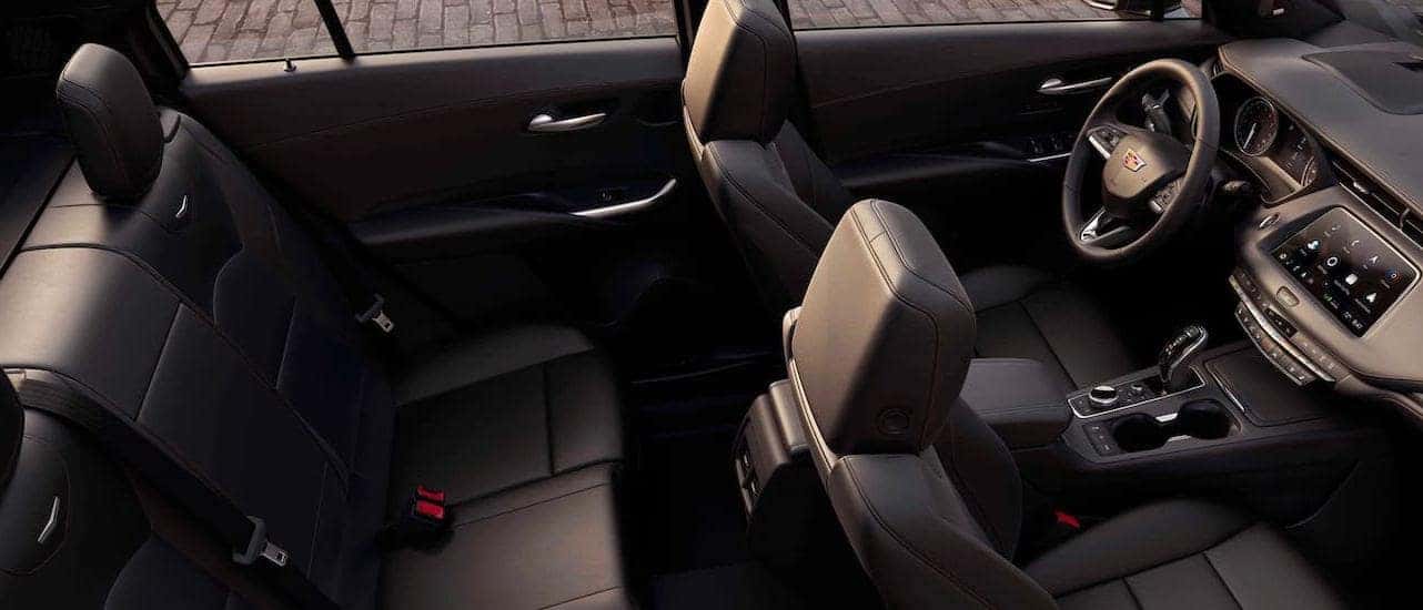 The black interior seats are shown inside a 2020 Cadillac XT4, winner of the 2020 Cadillac XT4 vs 2020 Volvo XC40 comparison, from a high angle.