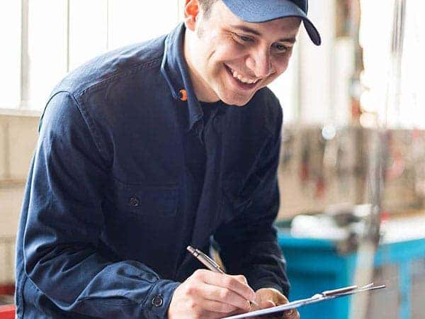 Mechanic doing an inspection with his clipboard