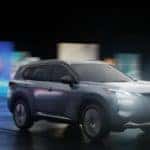 2021 nissan rogue driving through city