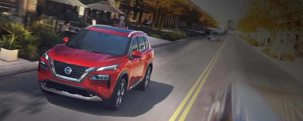 2021 Nissan Rogue driving down street