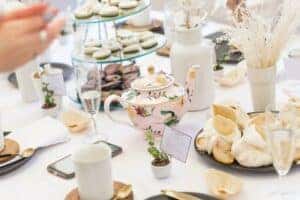 white and green floral ceramic teapot on table by Sincerely Media is licensed with Unsplash License