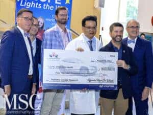 Dr. Andrew Koh with Hiley Hyundai representatives celebrating the $400K donation.
