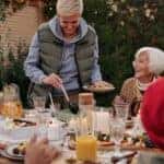 Family celebrating Thanksgiving outdoors
