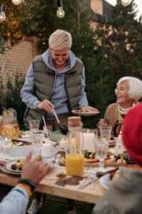 Family celebrating Thanksgiving outdoors