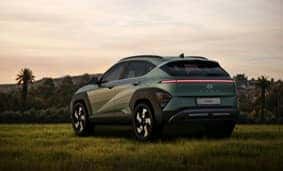 Green SUV in field