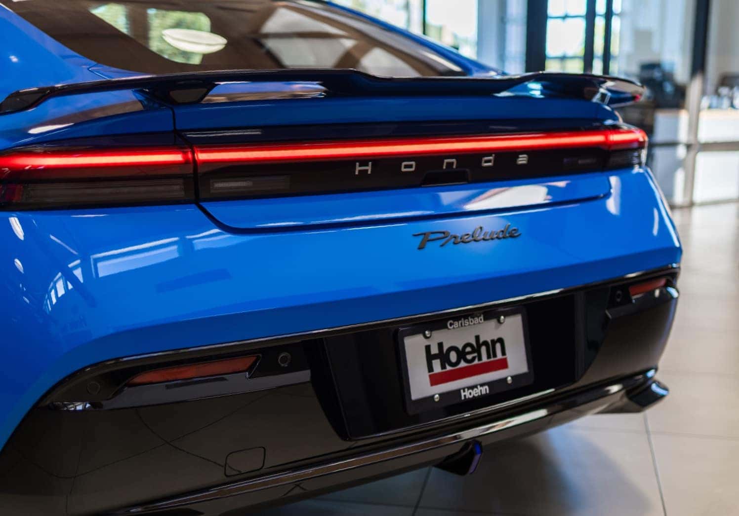 Rear of a blue Honda Prelude with a Hoehn license plate frame
