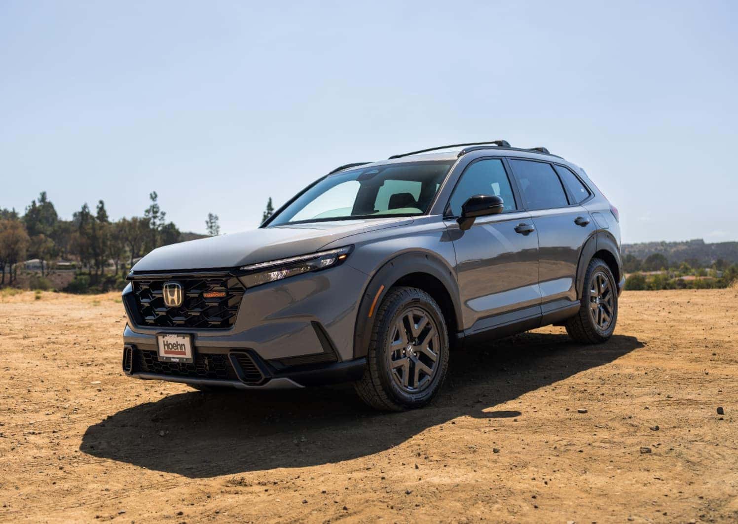 Gray Honda CR-V parked on a dirt lot