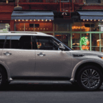 A 2021 INFINITI QX80 parked on a city street