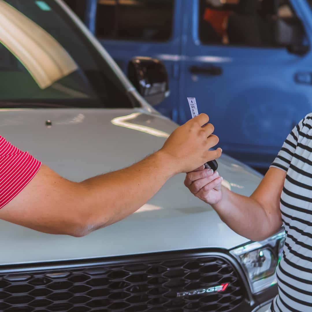 Happy customer trading in vehicle
