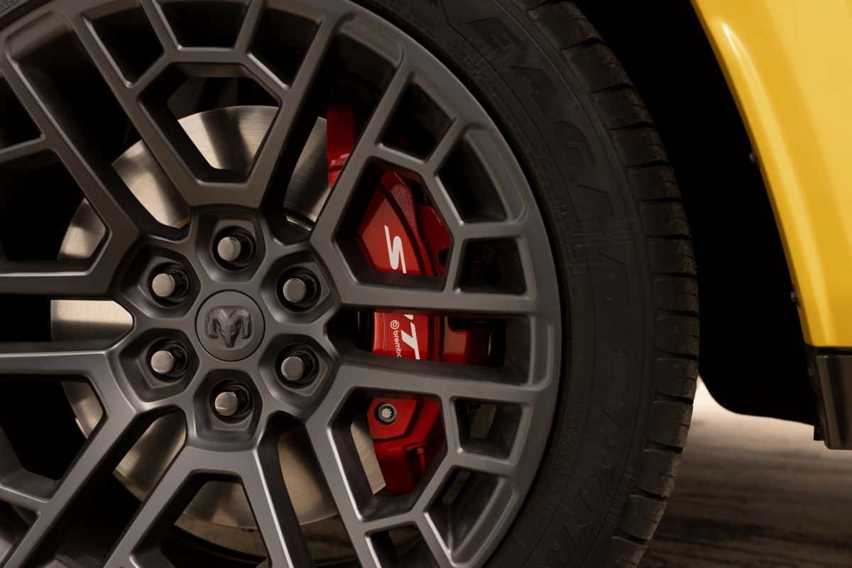 "Close-up of 22-inch aluminum performance wheel and 16-inch Brembo brakes on the 2027 Ram 1500 Rumble Bee