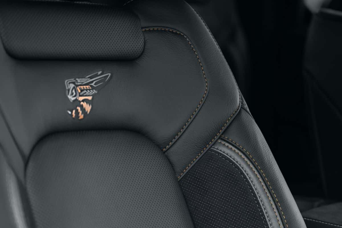 Custom black leather sport seats featuring yellow contrast stitching and embossed Rumble Bee logo
