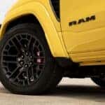 Close-up of 22-inch aluminum performance wheel and 16-inch Brembo brakes on the 2027 Ram 1500 Rumble Bee