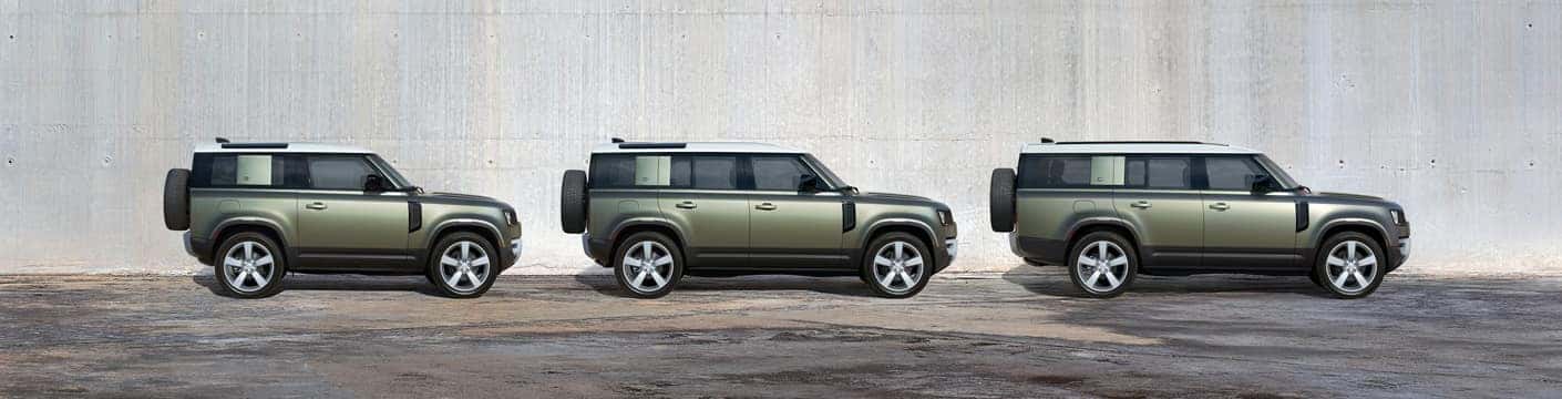 Three Land Rover models in a line
