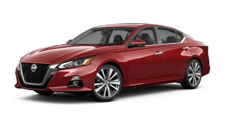 A red 2021 Nissan Altima is angled left.