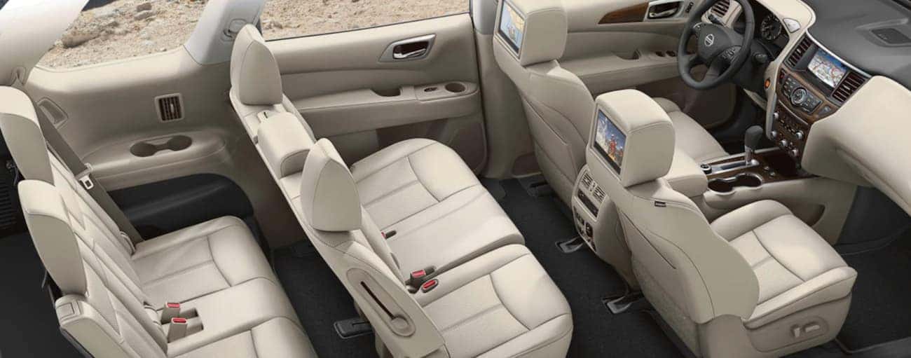 The white interior of a 2020 Nissan Pathfinder is shown from the side.