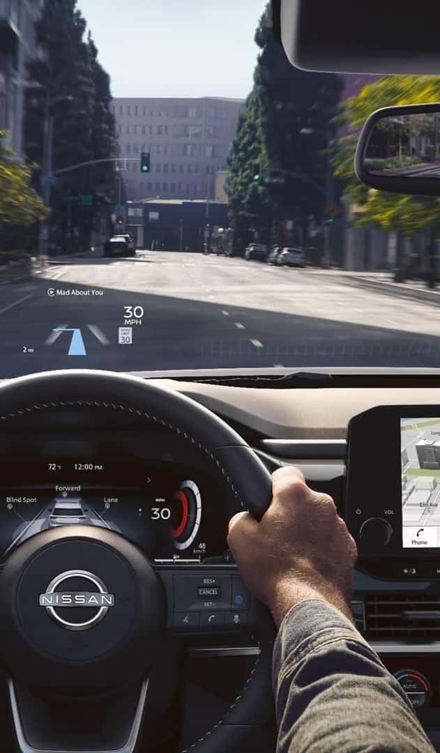 person driving, windshield view of road