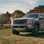 A grey 2022 Nissan Frontier Pro4x is shown parked by a lake after visiting a Nashville Nissan Frontier dealer.