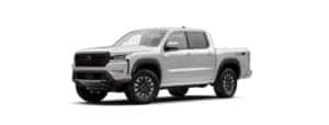 A white 2022 Nissan Frontier is angled left.