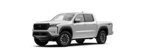 A white 2022 Nissan Frontier is angled left.