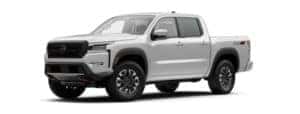 A white 2022 Nissan Frontier is angled left.