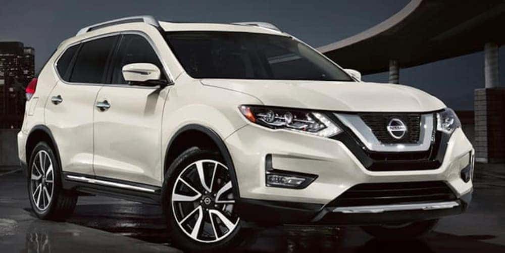 A white 2020 Nissan Rogue is shown from the front at an angle after leaving a Nashville used car dealer.