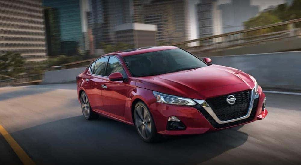 A red 2022 Nissan Altima is shown from the front at an angle.