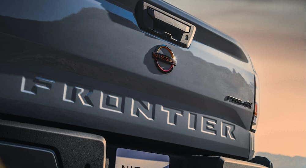 A close up of the tailgate on a grey 2023 Nissan Frontier PRO-4x