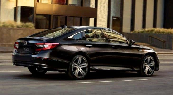 A black 2021 Nissan Altima is shown from the rear at an angle.