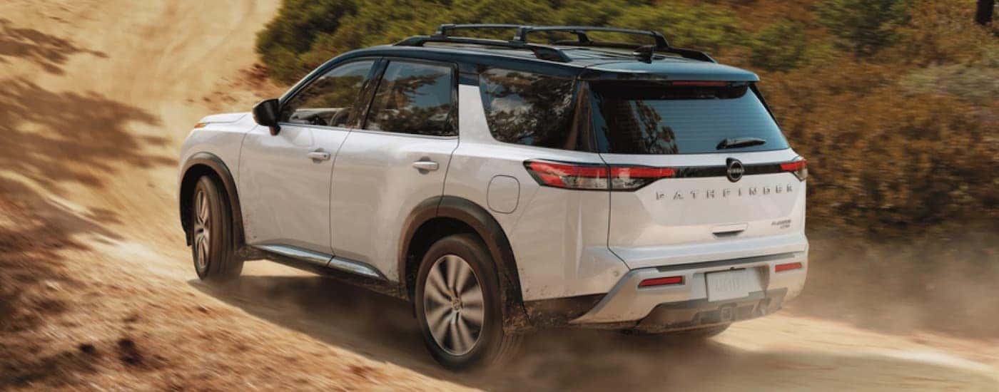 A white 2023 Nissan Pathfinder is shown from the rear at an angle after leaving a Nissan dealer near Columbia, TN.