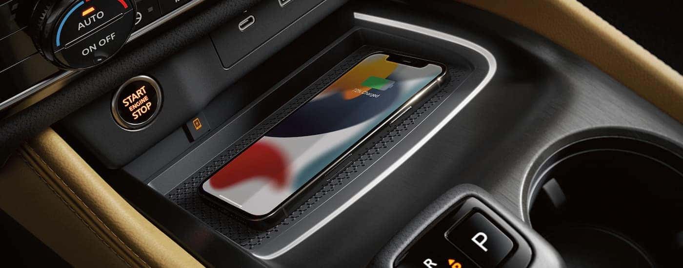 A close up of the center console in a 2023 Nissan Rogue is shown.