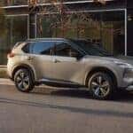 A popular Nissan Rogue near Columbia, TN, a silver 2023 Nissan Rogue, is shown parked near a store.