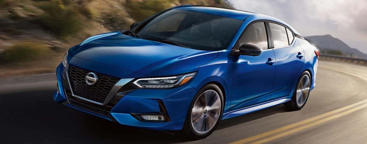 A blue 2023 Nissan Sentra is shown from the front at an angle.