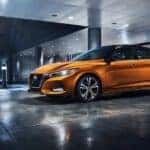 An orange 2023 Nissan Sentra is shown from the side after leaving a dealer that has a Nissan Sentra for sale in Shelbyville.