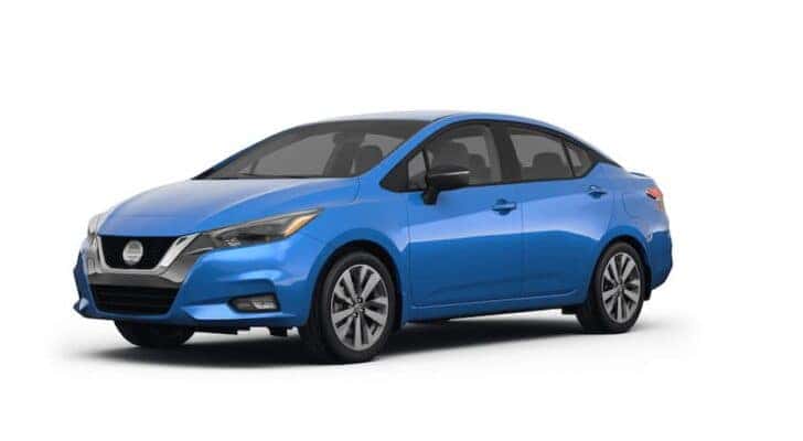 A blue 2023 Nissan Versa is shown angled left.