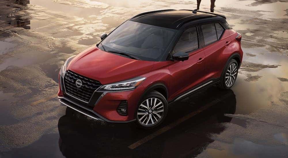 A red 2024 Nissan Kicks SV is shown from above.