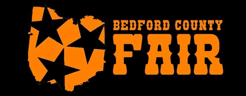 Bedford county fair logo with a black background and orange lettering