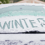 Winter on snowy windshield