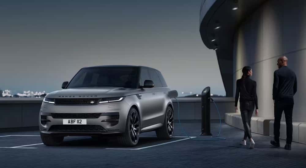 A silver 2025 Land Rover Range Rover Sport is shown from the front at an angle.