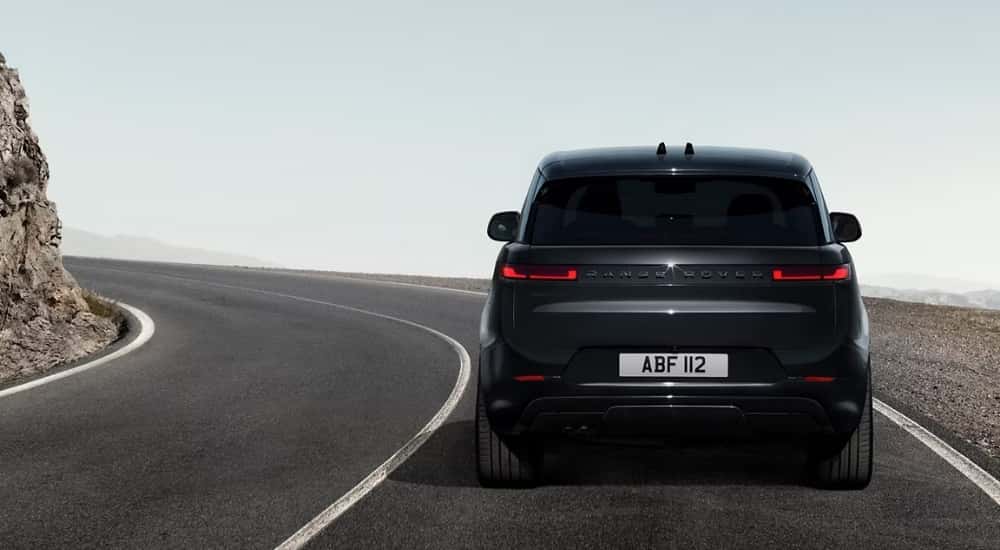 A black 2025 Land Rover Range Rover Sport is shown from the rear after leaving a Land Rover dealer.