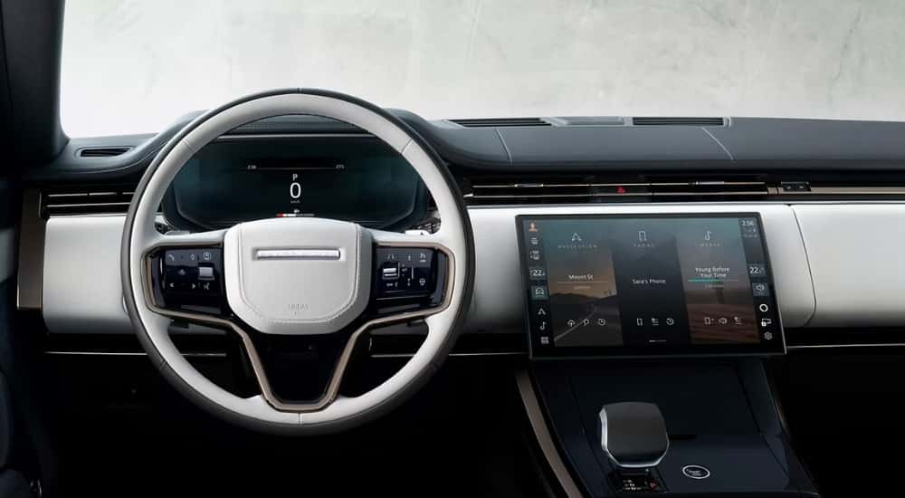The white interior of a 2025 Land Rover Range Rover Sport is shown.